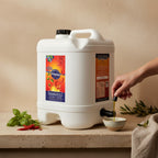 Adelaide Hills Harvest Chilli Press extra virgin olive oil in a 2L white plastic container being poured into a bowl.
