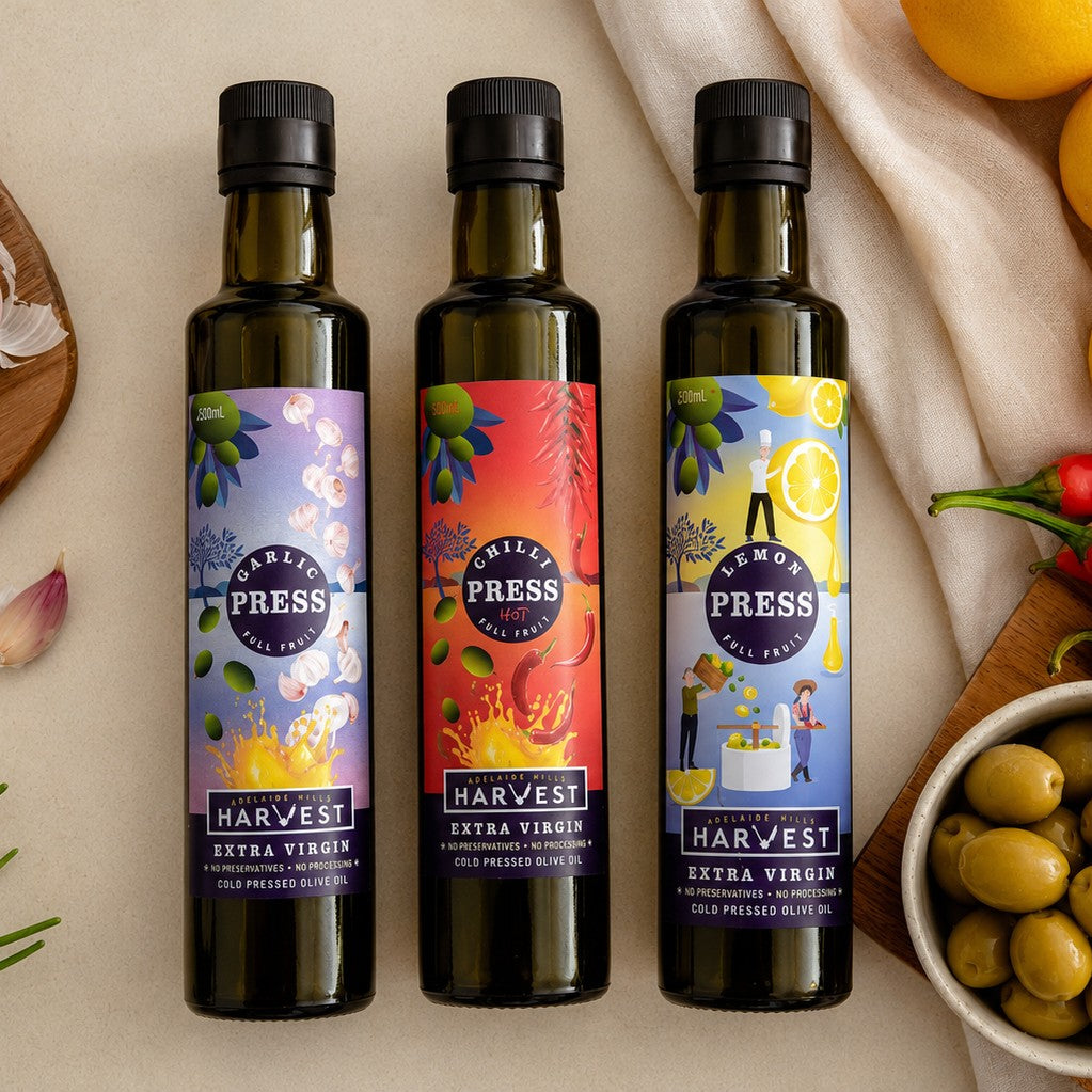 Adelaide Hills Harvest Pressed Trio set of garlic, chilli, and lemon infused extra virgin olive oils in glass bottles