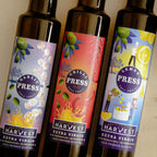Adelaide Hills Harvest Pressed Trio sample pack featuring Garlic, Chilli, and Lemon cold-pressed olive oil bottles.